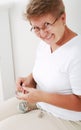 Elderly woman knitting