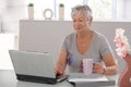 Elderly woman with laptop