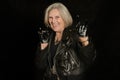 Elderly woman in leather jacket