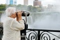 Elderly woman looking at american falls in niagara Royalty Free Stock Photo