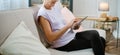 elderly woman looking at the screen of her digital tablet . Royalty Free Stock Photo