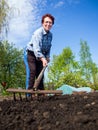 Elderly woman loose soil rake