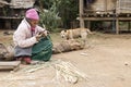 Elderly Woman Making Baskets