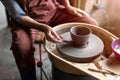 Elderly woman making ceramic work with potter`s wheel Royalty Free Stock Photo