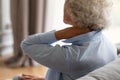 Elderly woman massaging neck tensed muscles reduces pain closeup view Royalty Free Stock Photo