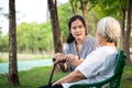 Elderly woman or mother with depressive symptoms or alzheimer patient,asian female caregiver or daughter holding elderly patient Royalty Free Stock Photo