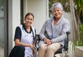 Elderly woman, nurse and wheelchair with portrait at nursing home for help, healthcare and love. Senior person Royalty Free Stock Photo