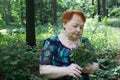 Elderly woman park summer with flowers hands seniors grandma Royalty Free Stock Photo