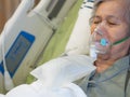 Elderly woman patients with lung disease, getting oxygen for treatment in the room at the hospital. Space for text
