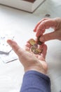 An elderly woman pensioner counts ukrainian coins money