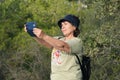 Elderly woman photographs the landscape during a hiking trip Royalty Free Stock Photo