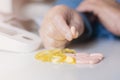 Elderly woman with pills hand, grandmother with medicines