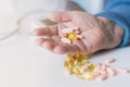 Elderly woman with pills hand, grandmother with medicines