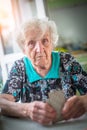 An elderly woman playing cards. Royalty Free Stock Photo