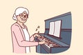 Elderly woman plays piano and smiles, rejoicing at presence of creative musical hobby