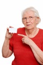 Elderly woman pointing to a business card Royalty Free Stock Photo