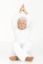 Elderly woman practicing yoga