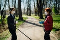 Elderly woman with protective face mask/gloves talking with a friend.Coronavirus COVID-19 disease protection.Conversation from a Royalty Free Stock Photo