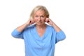 Elderly woman pulling at the skin on her jowls Royalty Free Stock Photo