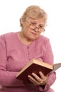 The elderly woman reads the book Royalty Free Stock Photo