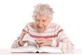 Elderly woman reads the book Royalty Free Stock Photo