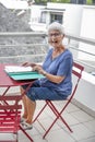 Elderly woman handling administrative documents