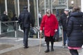 An elderly woman in a red coat with a cane came out of the exit at Liverpool Station Royalty Free Stock Photo