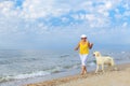 Elderly woman running with her golder retriever Royalty Free Stock Photo