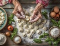 Elderly woman\'s hands making homemade tortellini on wooden table