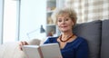 Elderly woman self-isolation reading book at home Royalty Free Stock Photo