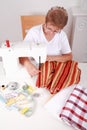 Elderly woman sewing