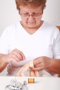 Elderly woman sewing Royalty Free Stock Photo