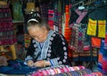 Elderly woman sewing