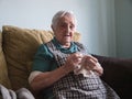 Elderly woman sewing at home Royalty Free Stock Photo
