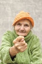 Elderly woman showing fig sign. Royalty Free Stock Photo