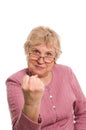 The elderly woman shows a fist Royalty Free Stock Photo