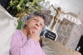 Elderly woman sitting alone in chapel rest Royalty Free Stock Photo