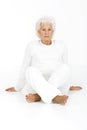 Elderly woman sitting on the floor