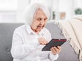 Elderly woman with tablet Royalty Free Stock Photo