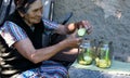 Elderly woman slice squash for cooking at home