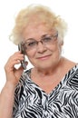 Elderly woman speaks on phone