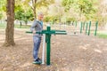 Elderly Woman Exercising At Public Sports Park Royalty Free Stock Photo