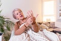 Elderly woman suffering from pain in hand, arthritis old person and senior woman female suffering from pain at home Royalty Free Stock Photo