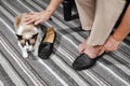 Elderly woman swollen feet putting on shoes Royalty Free Stock Photo