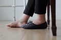 Elderly woman swollen feet putting on shoes Royalty Free Stock Photo