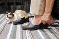 Elderly woman swollen feet putting on shoes Royalty Free Stock Photo