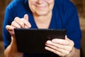 Elderly woman with tablet computer Royalty Free Stock Photo