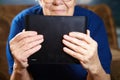 Elderly woman with tablet computer Royalty Free Stock Photo