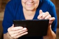 Elderly woman with tablet computer Royalty Free Stock Photo