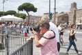 Elederly tourist couple taking photo in Rome, Italy